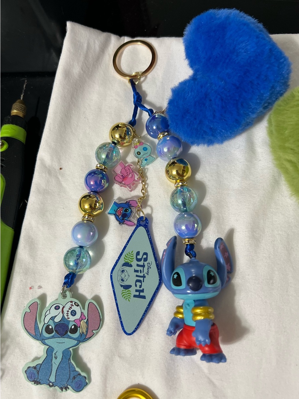 Disney Blue Stitch Charm Keychain with Gold Accents and Blue Pom